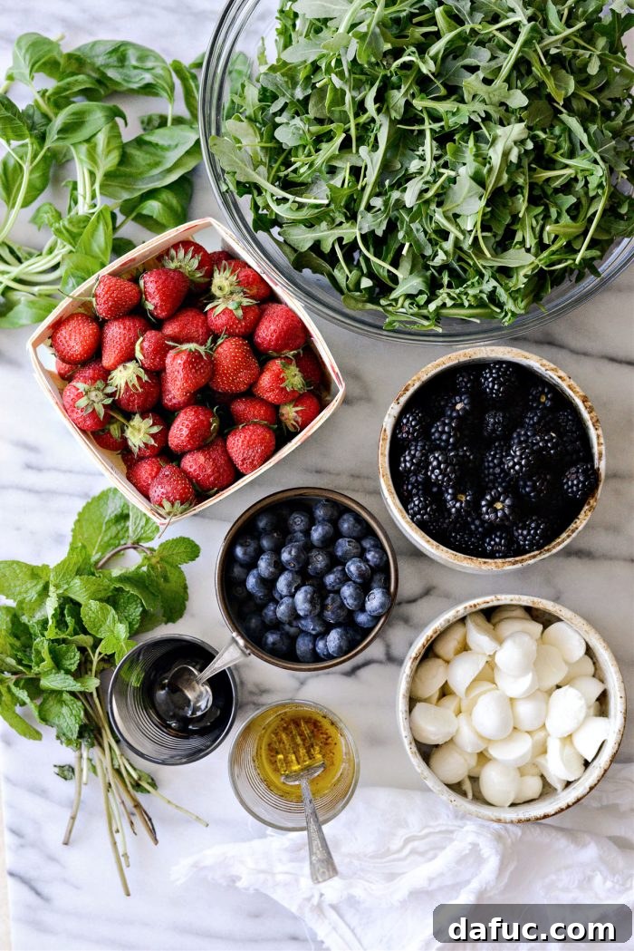 Summer Berry Caprese Salad 4 Ingredients for Berry Caprese Salad laid out on a table