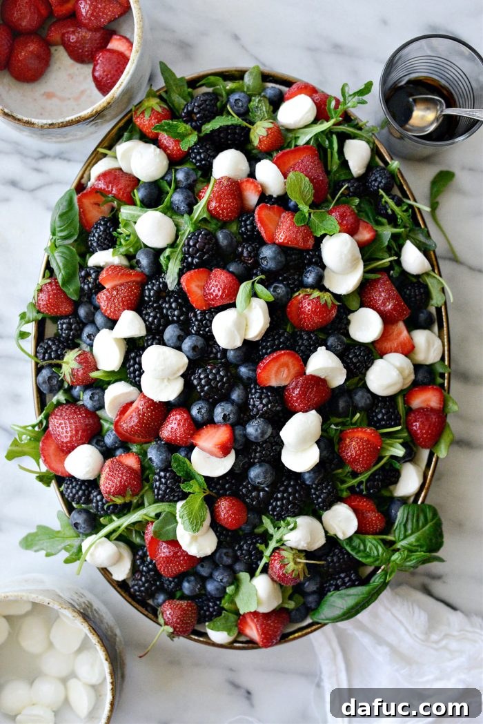 Summer Berry Caprese Salad 10 Salad topped with fresh berries and mozzarella balls