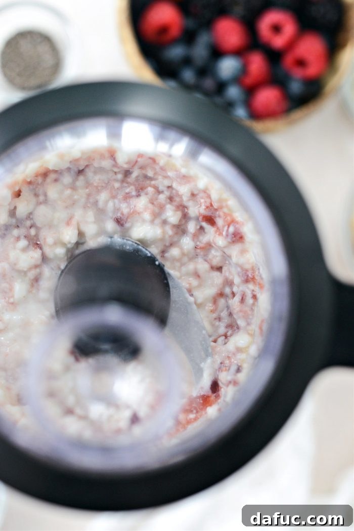 Decadent Strawberry Cheesecake Granola Bowl 6 Blending cottage cheese, jam, and vanilla for a smooth mixture