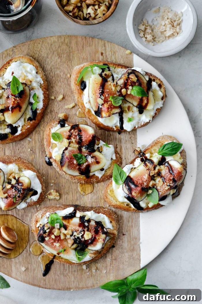 Honey Balsamic Fig and Burrata Crostini - A gourmet appetizer with fresh figs, burrata, honey, and balsamic glaze on toasted bread.