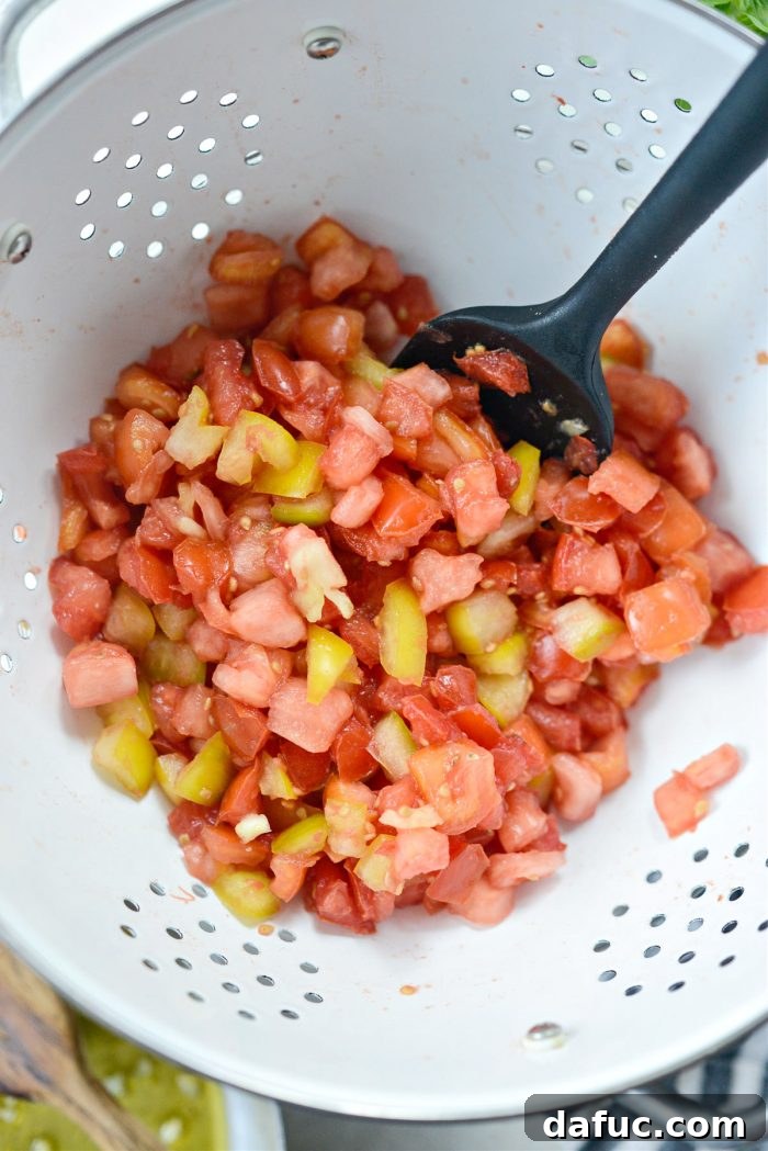 Vibrant Heirloom Tomato Bruschetta 12 Perfectly softened and concentrated diced tomatoes in a colander after draining excess liquid.