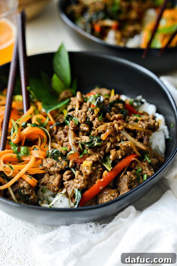 Plated Thai Basil Beef with rice and fresh garnish