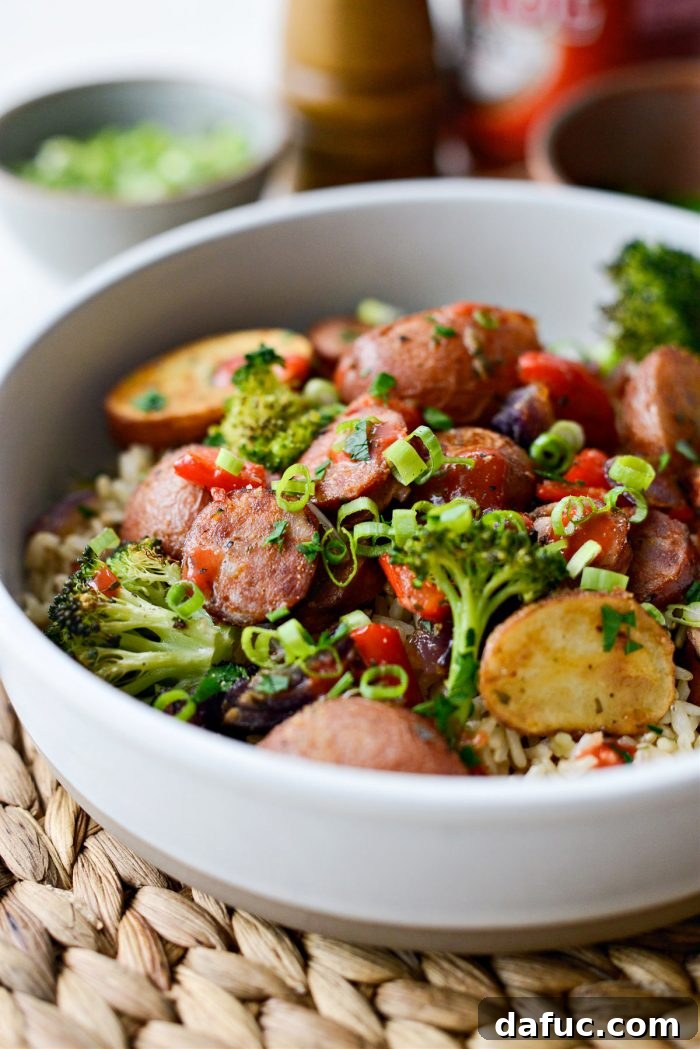 Sheet Pan Andouille Sausage and Vegetables served with rice