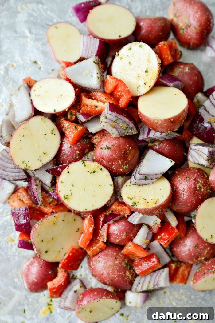 Toss vegetables to combine thoroughly with oil and spices