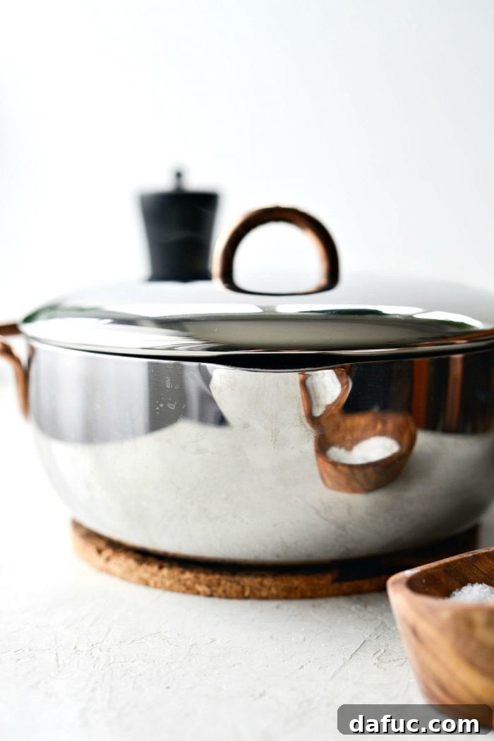 Rice pilaf simmering on low heat, covered, in a saucepan