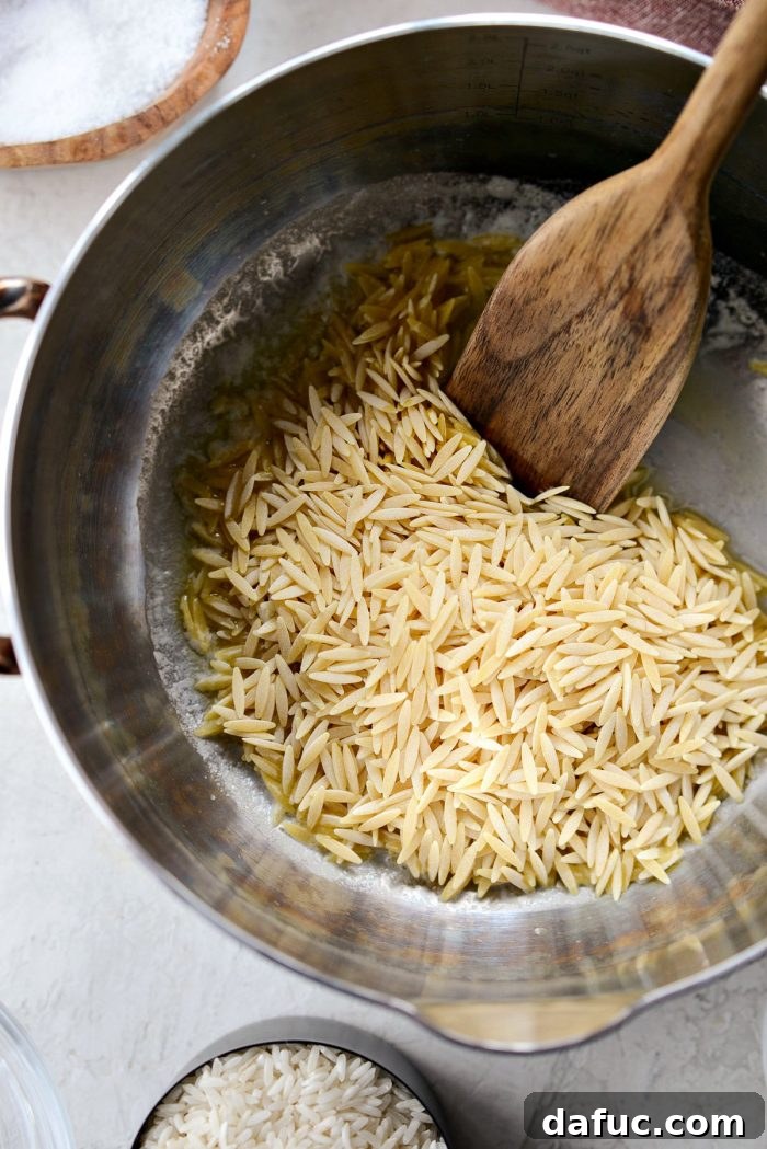 Melting unsalted butter in a saucepan over medium heat for rice pilaf