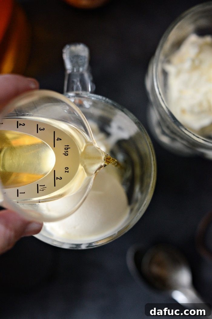 Red Hot Root Beer Float 7 Pouring Fireball whiskey into a mug with ice cream