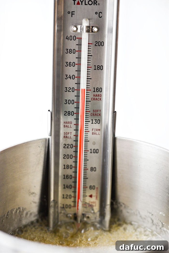 Sweet & Simple Homemade Caramel Apples 11 thermometer reading 320 for caramel