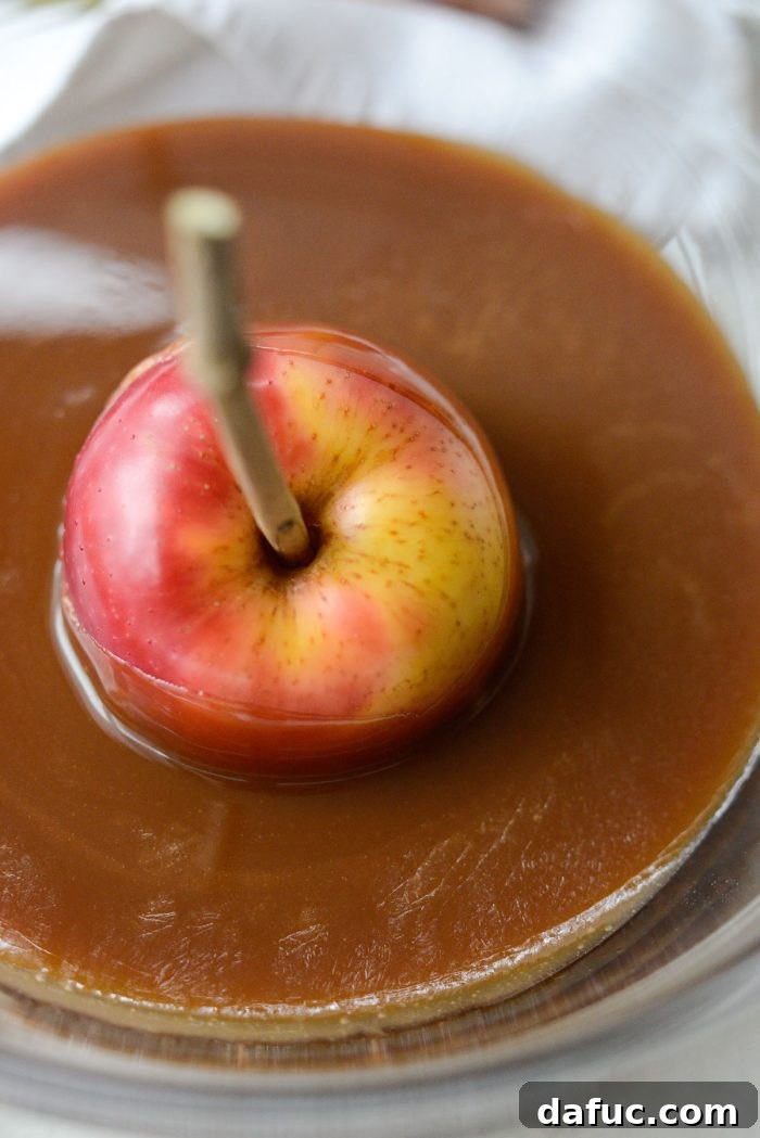 Sweet & Simple Homemade Caramel Apples 18 dip apples in caramel