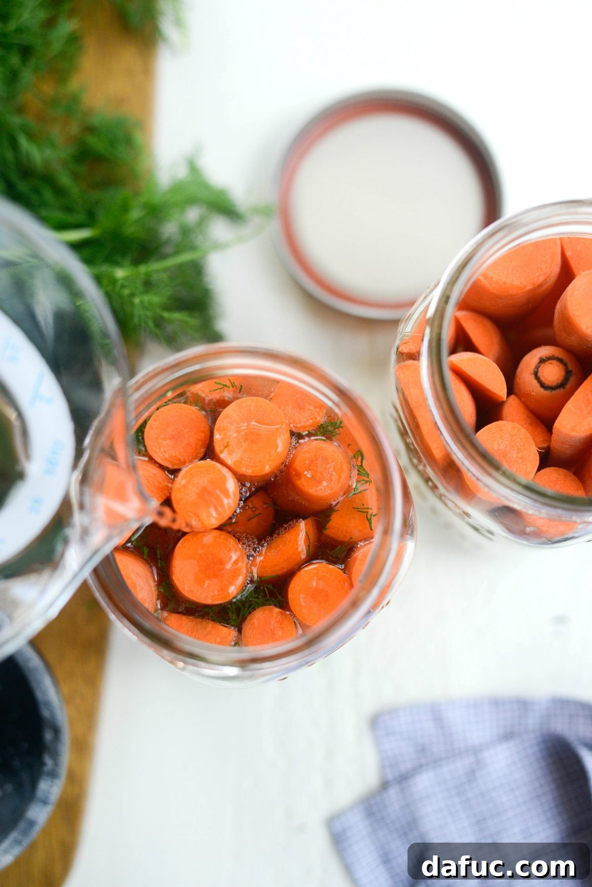 Probiotic Dill Carrot Sticks 10 adding water to jars