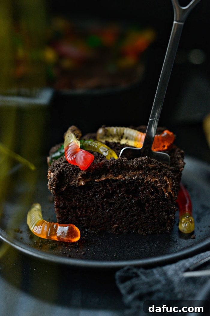 Decadent Chocolate Garden Delight 2 Rich Chocolate Dirt Cake topped with creamy frosting, cookie crumbs, and colorful gummy worms