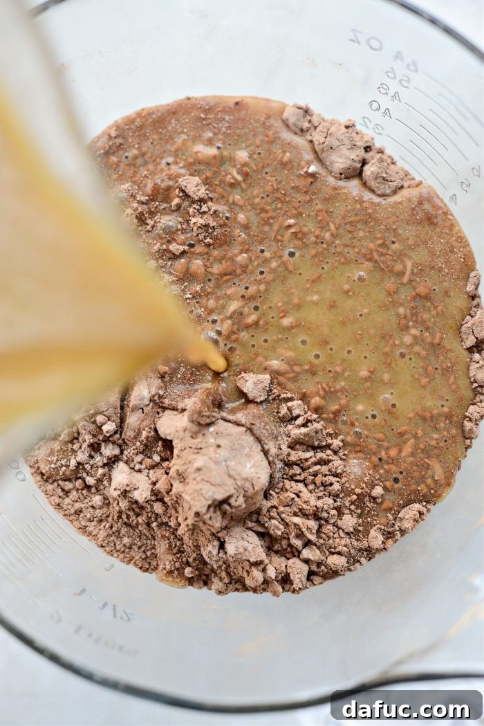 Decadent Chocolate Garden Delight 13 Pouring wet ingredients into the bowl of dry ingredients