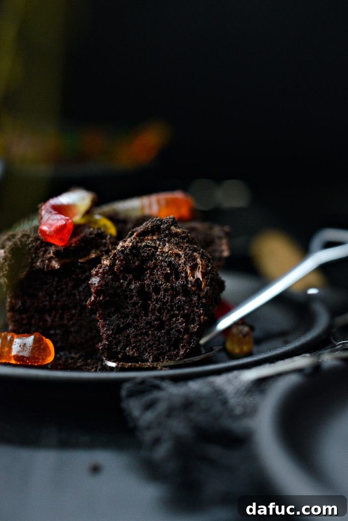 Decadent Chocolate Garden Delight 3 Close-up view of a slice of Chocolate Dirt Cake revealing moist layers and crumb texture