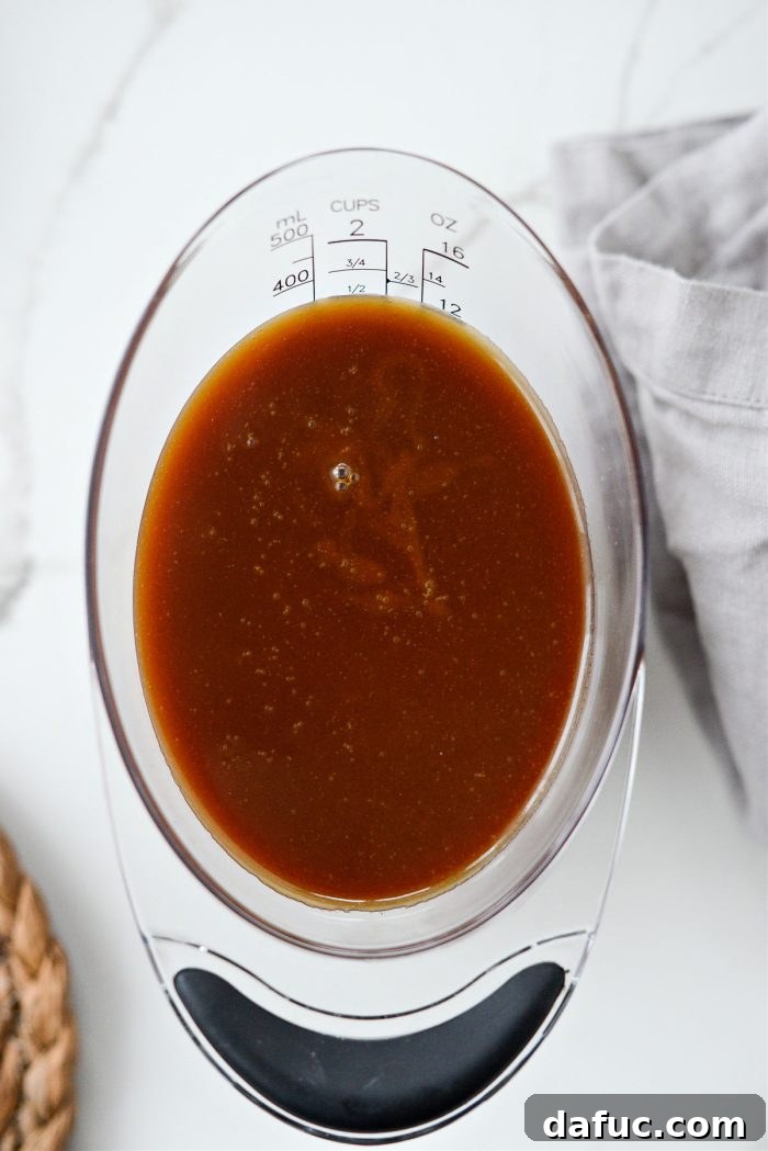 Transferring caramel sauce to a measuring cup to cool