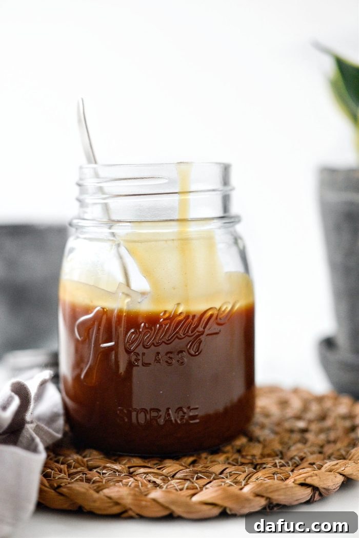 Closeup of very thick Caramel Brûlée Sauce in a jar