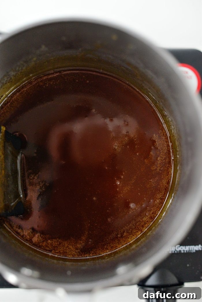 Removing the pan from heat after sugar reaches a deep golden color