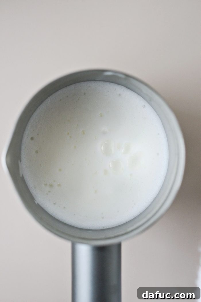 Caramel Brulee Latte 8 Frothed milk in a frother