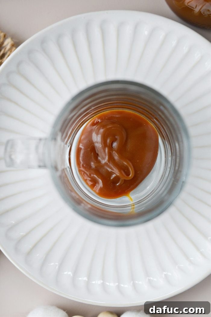 Caramel Brulee Latte 5 Caramel sauce in the bottom of a mug
