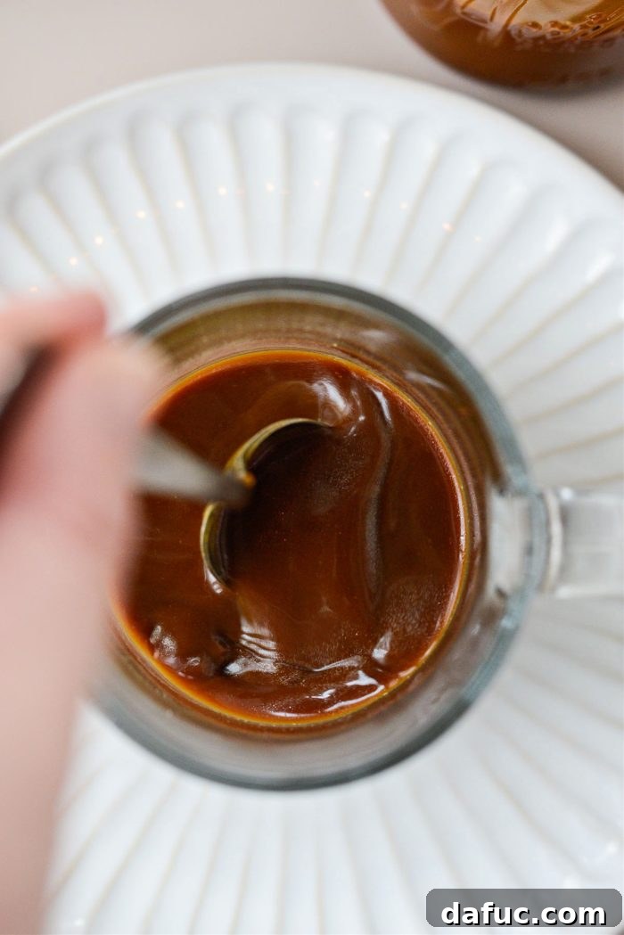 Caramel Brulee Latte 7 Stirring espresso with caramel in mug