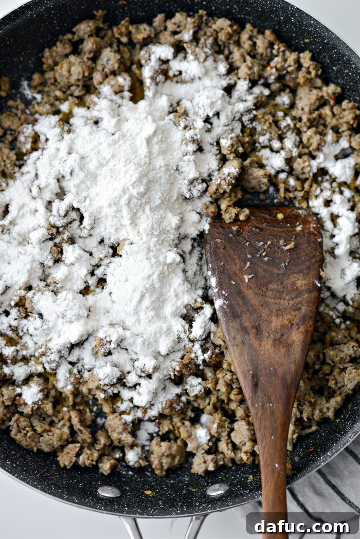 Spicy Farmhouse Breakfast Sausage Gravy 12 sprinkle in flour