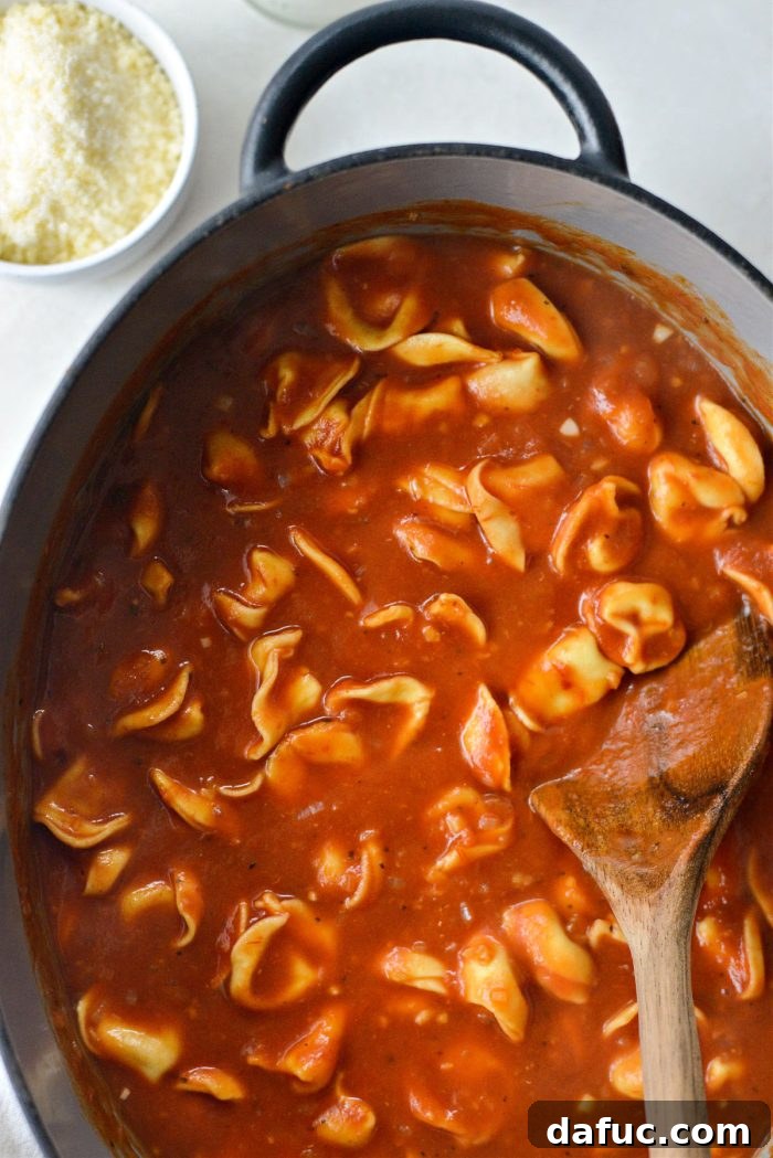 Cooked tortellini in the soup.