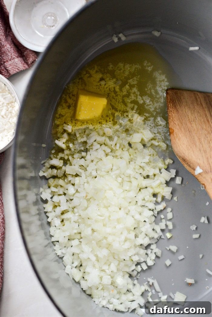 Sautéing onions in butter in a Dutch oven.