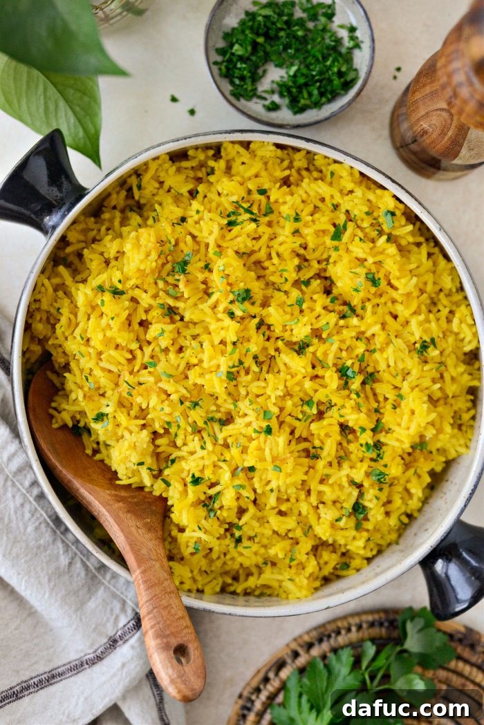 Golden Turmeric Rice 2 Fluffy golden Turmeric Rice served in a bowl