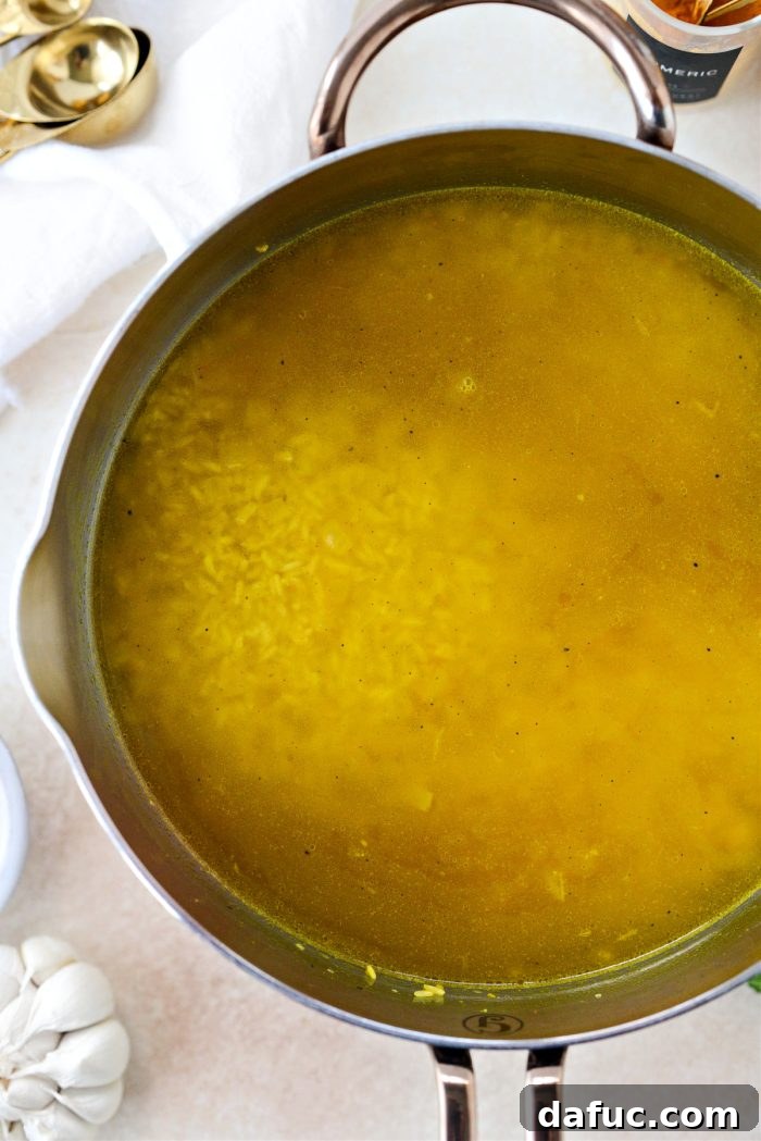 Golden Turmeric Rice 14 Rice mixture boiling rapidly