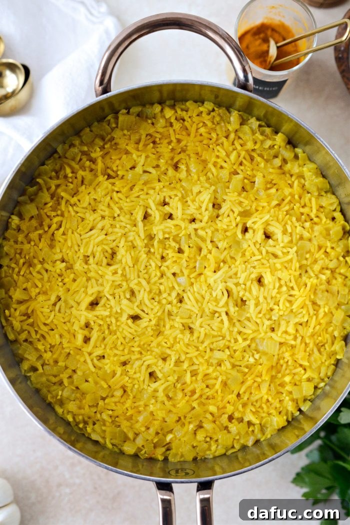 Golden Turmeric Rice 16 Uncovered pot of perfectly cooked Turmeric Rice