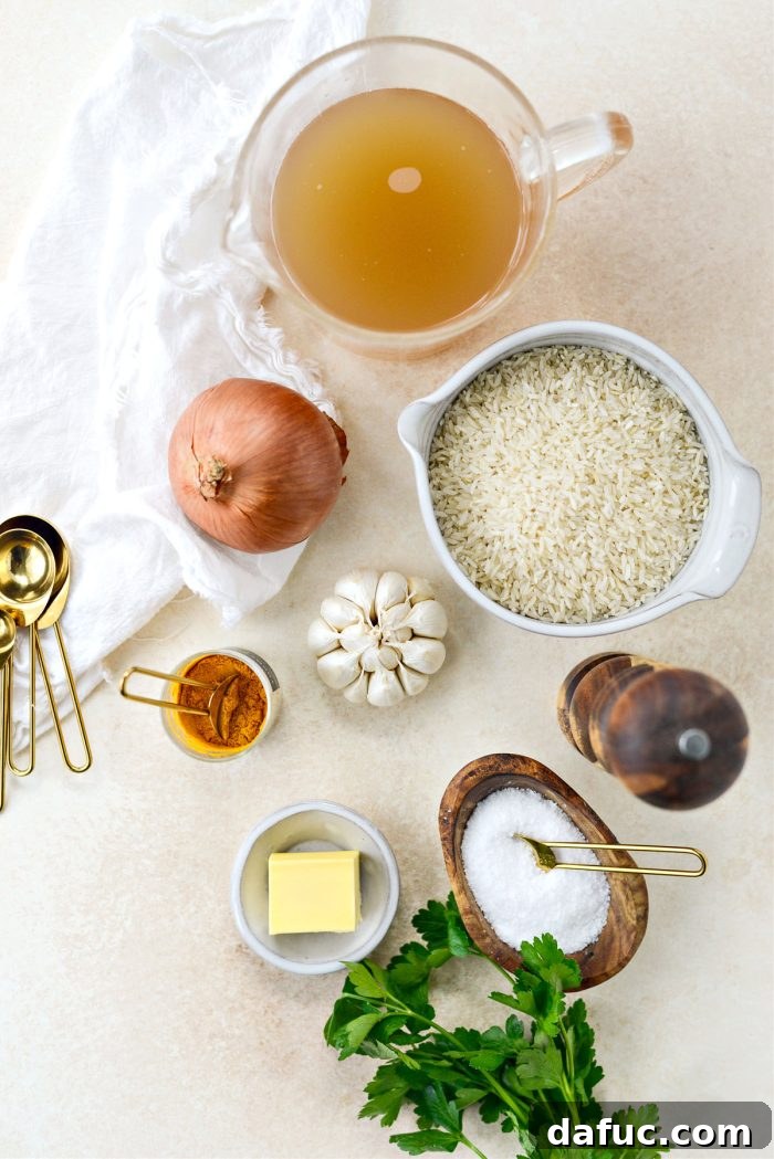 Golden Turmeric Rice 4 Ingredients for Turmeric Rice laid out on a table