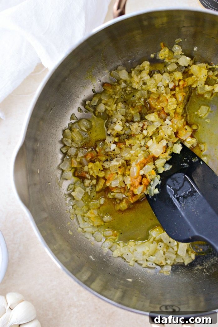 Golden Turmeric Rice 9 Stirring spices into sautéed onions and garlic