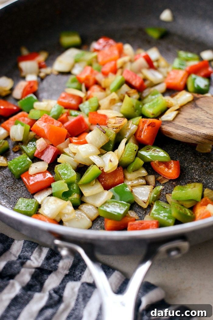 Guilt-Free Sesame Chicken 11 Sautéing Bell Peppers and Onions for Stir-fry