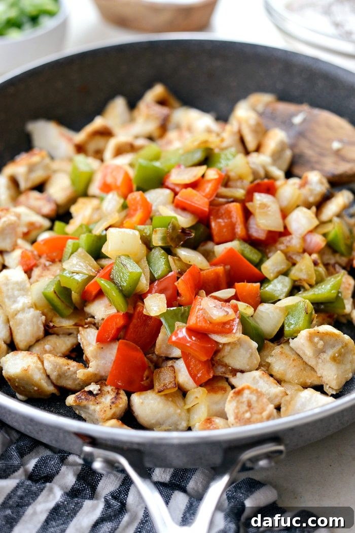 Guilt-Free Sesame Chicken 14 Breaking Apart Chicken in Skillet