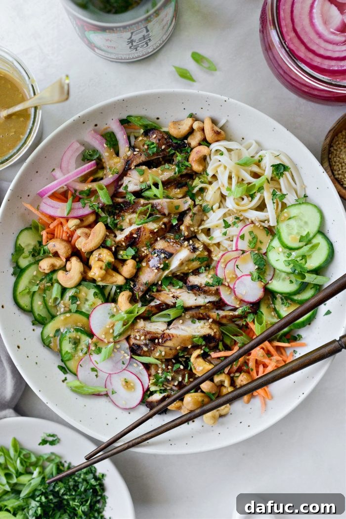 Savory Sesame Grilled Chicken Noodle Bowls 11 Another perspective of a finished grilled sesame chicken noodle bowl, garnished with fresh herbs and sesame seeds