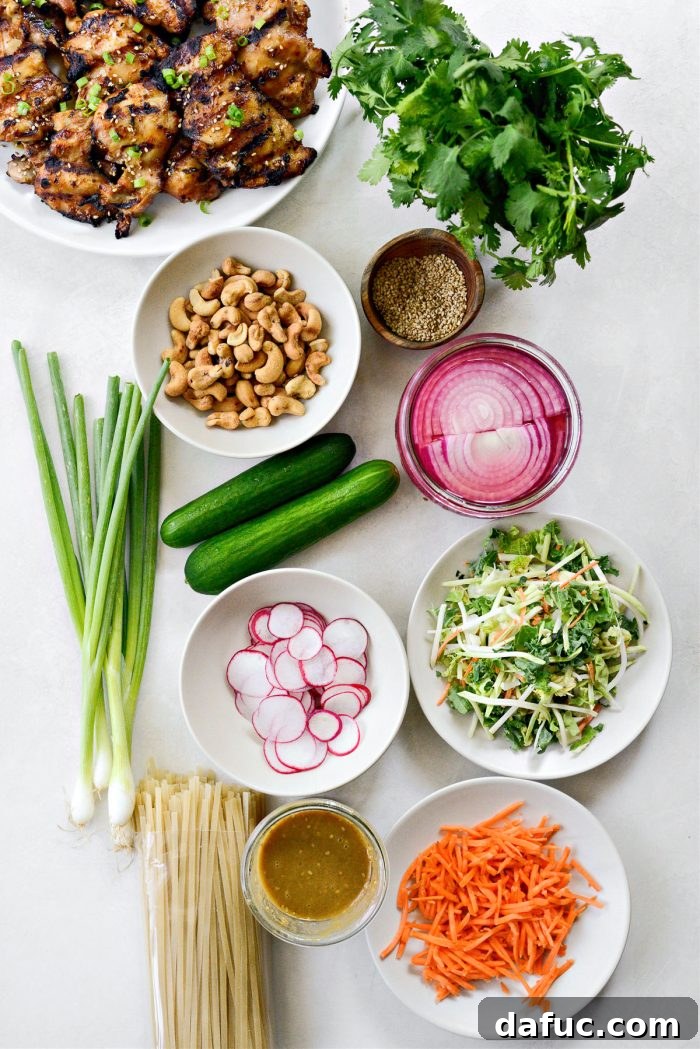 Savory Sesame Grilled Chicken Noodle Bowls 4 Fresh ingredients laid out for grilled sesame chicken noodle bowls, including vegetables, noodles, and chicken