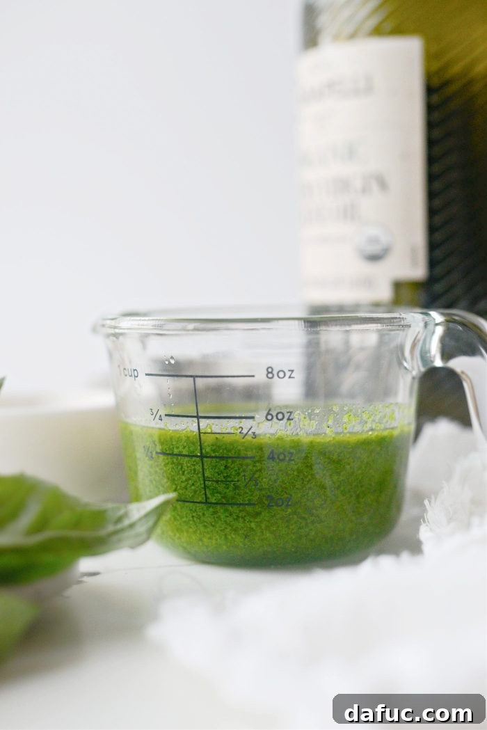 Effortless Fresh Basil Oil 3 Close-up of Fresh Basil Oil in a Bowl