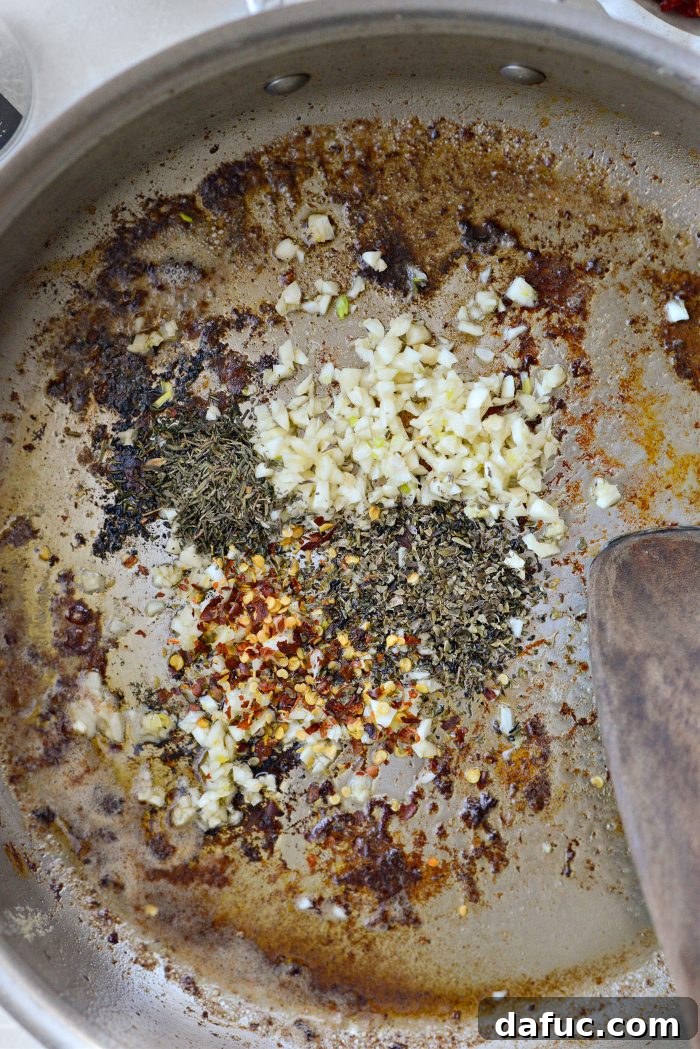 The I Do Chicken 12 Sautéing garlic, dried herbs, and red pepper flakes in the skillet