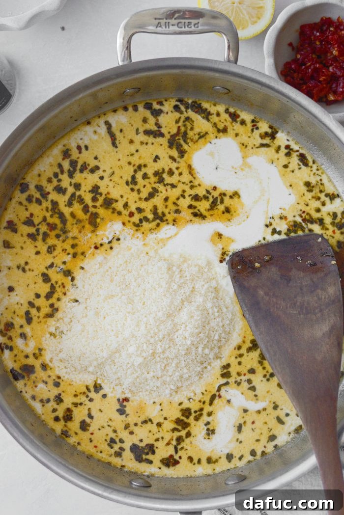 The I Do Chicken 15 Stirring freshly grated Parmesan cheese into the creamy sauce base
