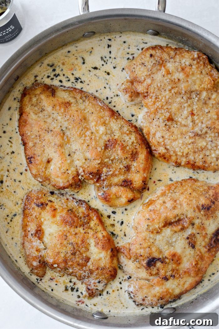 The I Do Chicken 17 Cooked chicken breasts returning to the pan to simmer in the cream sauce