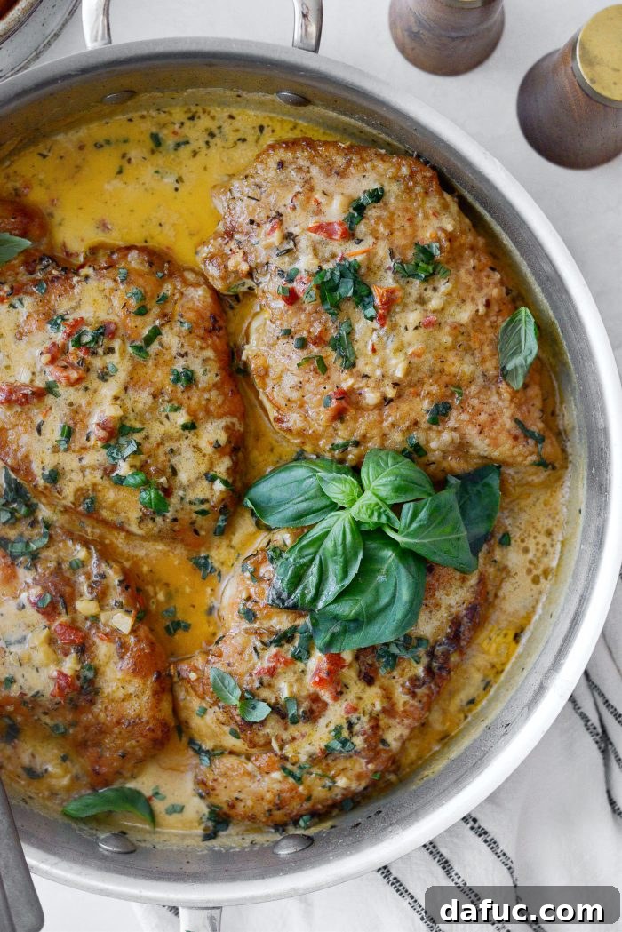 The I Do Chicken 20 Marry Me Chicken garnished with fresh basil and extra Parmesan cheese