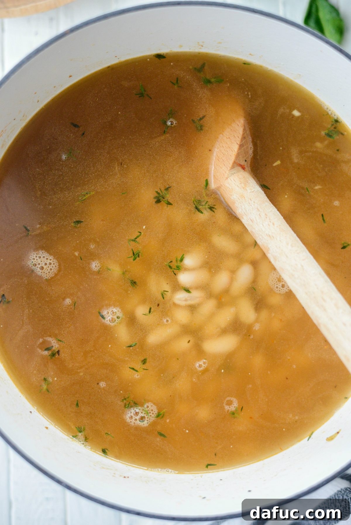 Rustic Chicken Sausage and White Bean Pot 13 Finished Chicken Sausage White Bean Stew in a bowl with Parmesan and crusty bread