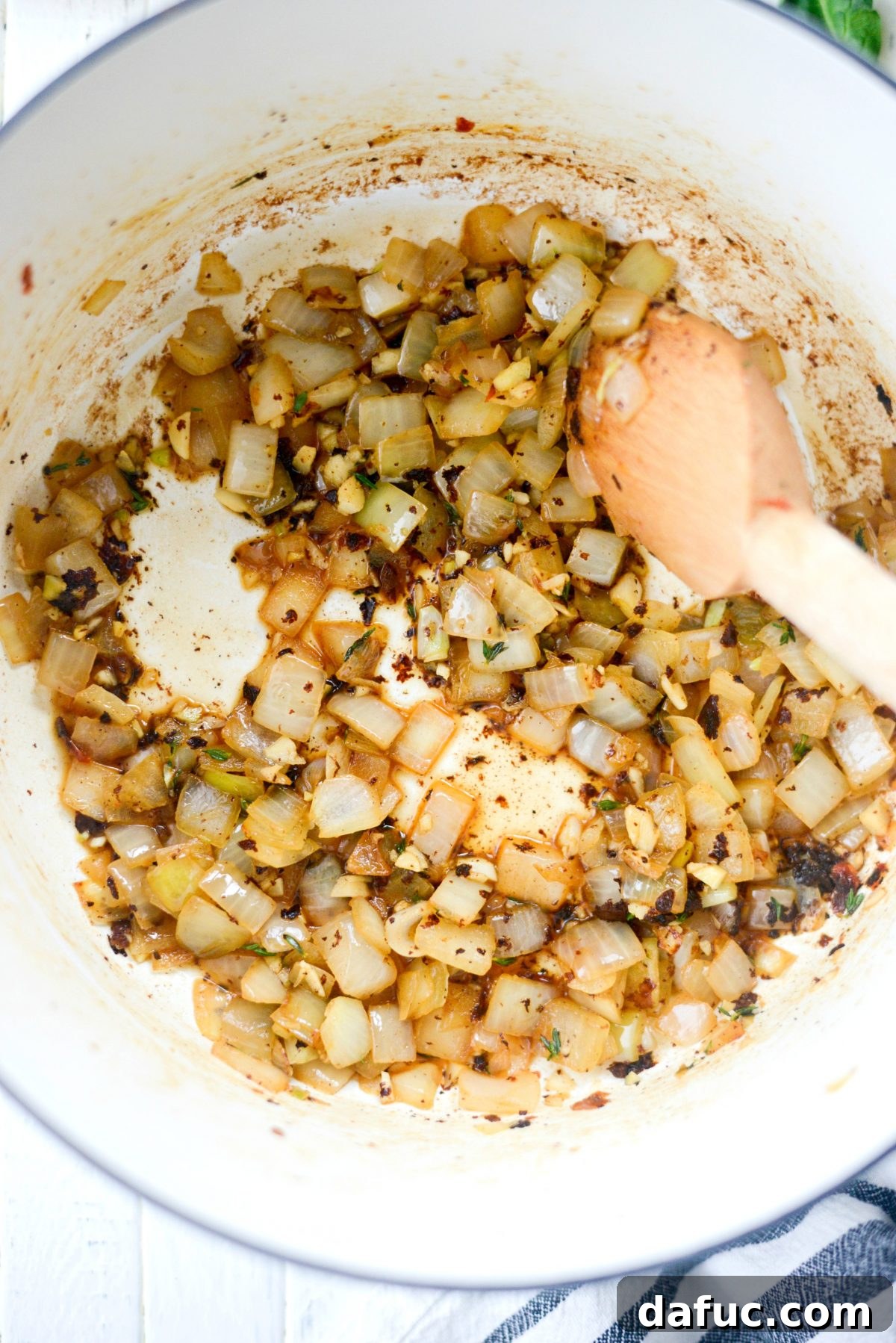 Rustic Chicken Sausage and White Bean Pot 10 Pouring chicken stock into the pot