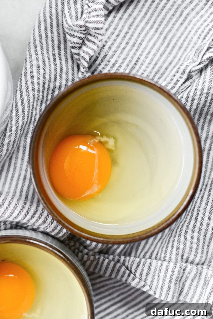 crack eggs into shallow bowls