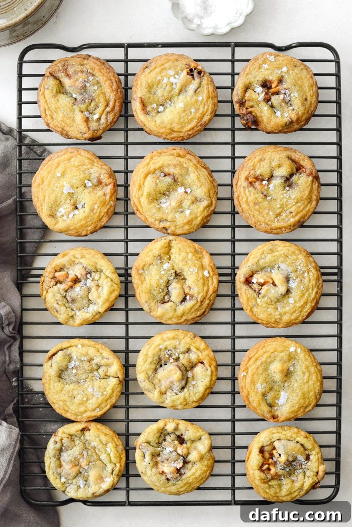 Cooling Salted Snickers Cookies on a baking sheet