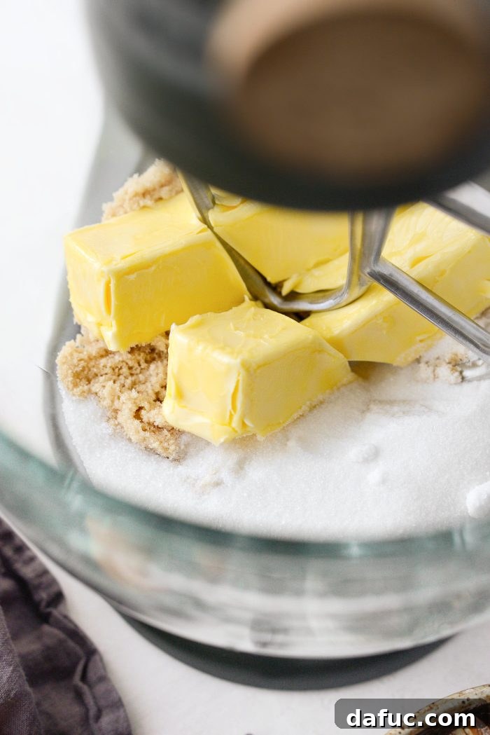 Add butter and sugars to a stand mixer bowl