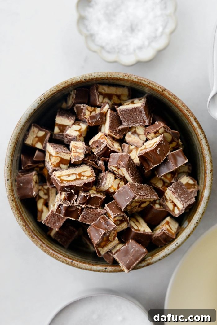 Chopped Snickers candy bars ready for cookie dough