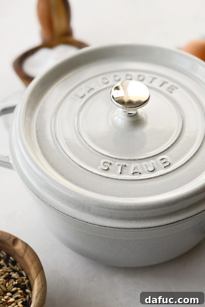 Covering the pot to bring broth to a boil.