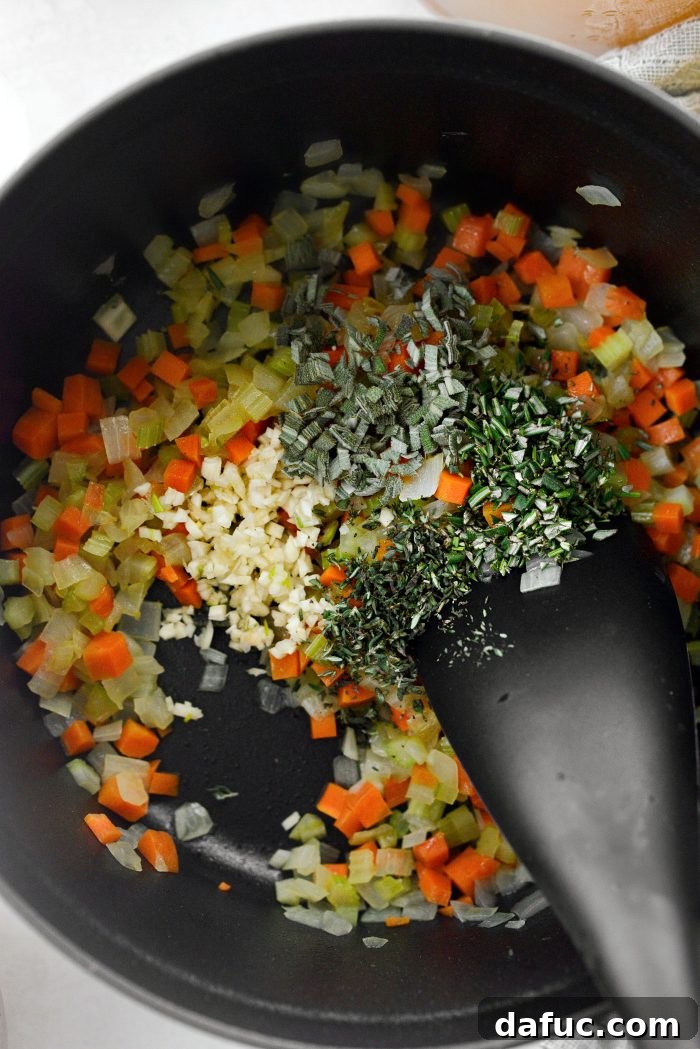Sautéed vegetables ready for garlic and herbs.
