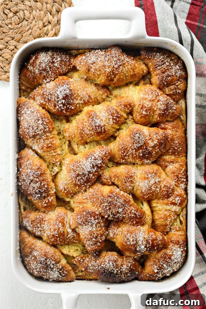 The freshly baked Eggnog Croissant French Toast Bake, golden and inviting, just out of the oven.