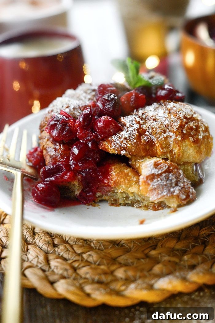 A beautifully presented Eggnog Croissant French Toast Bake, ready to be enjoyed by a family on Christmas morning.